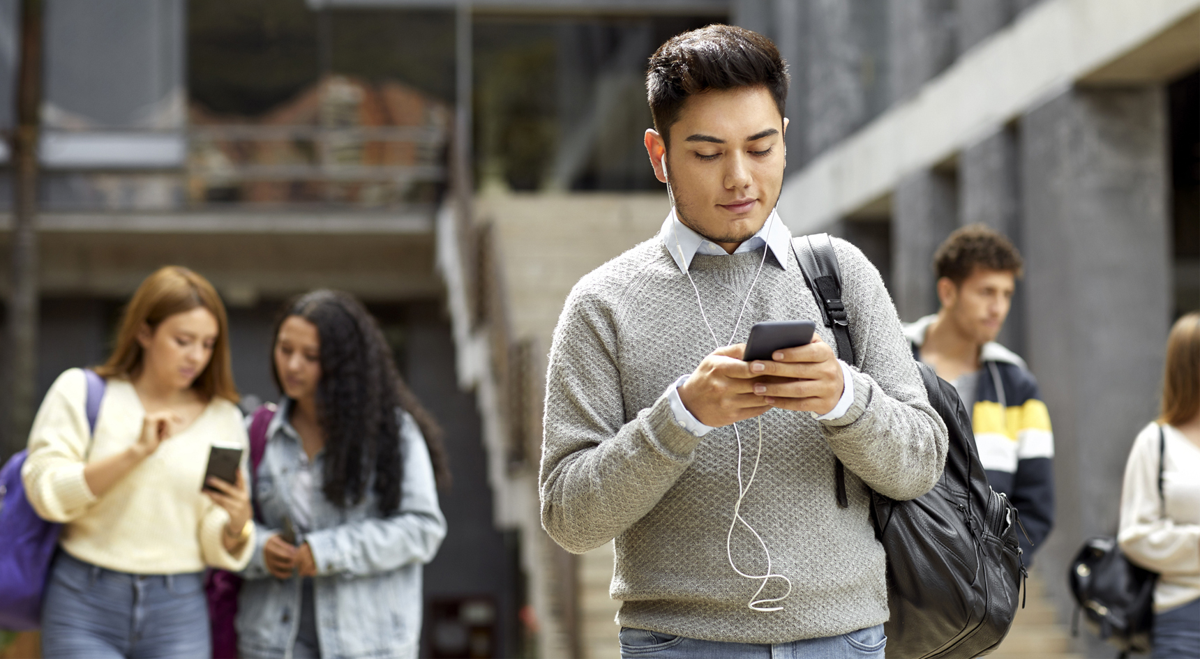 A person texting and walking.