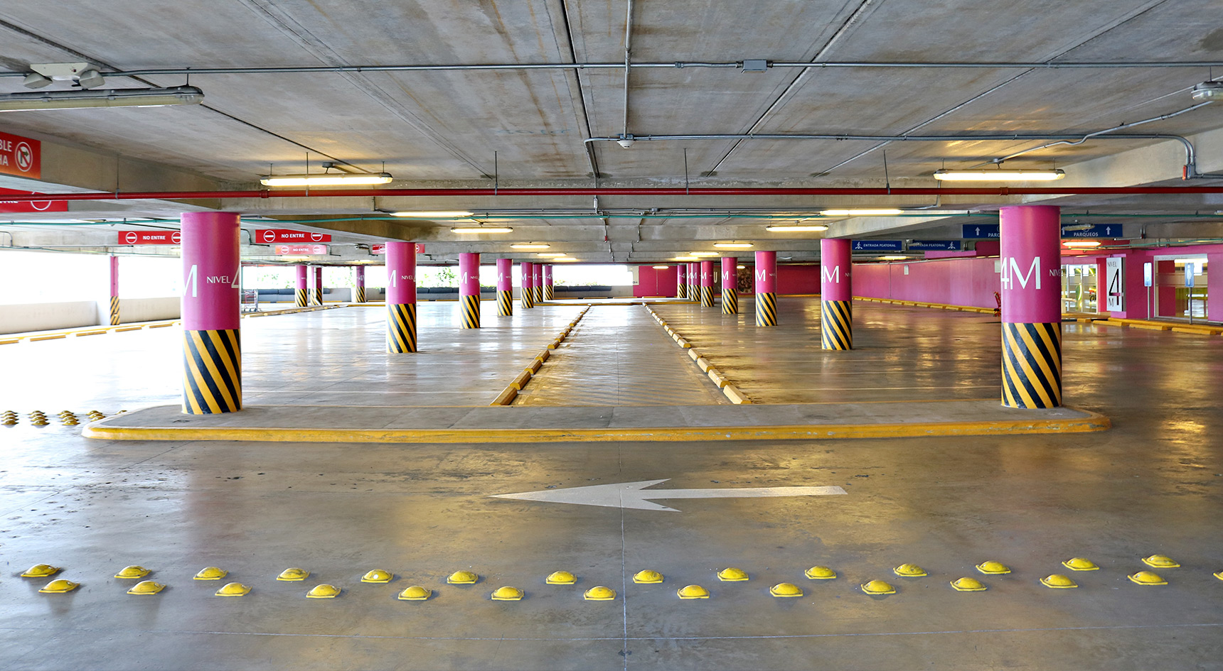 Empty parking lot with arrow signs.