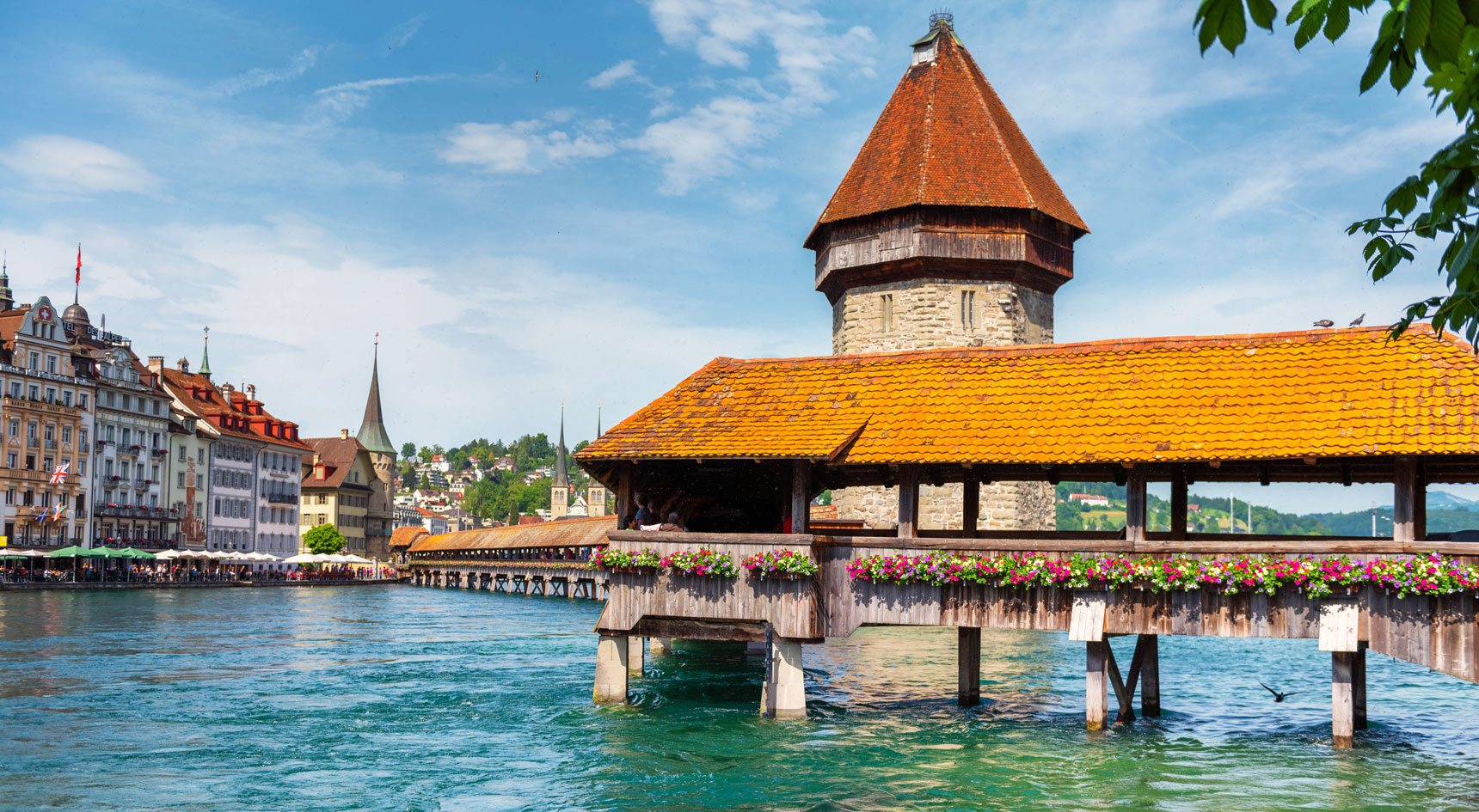 Quaint buildings built over bright blue water