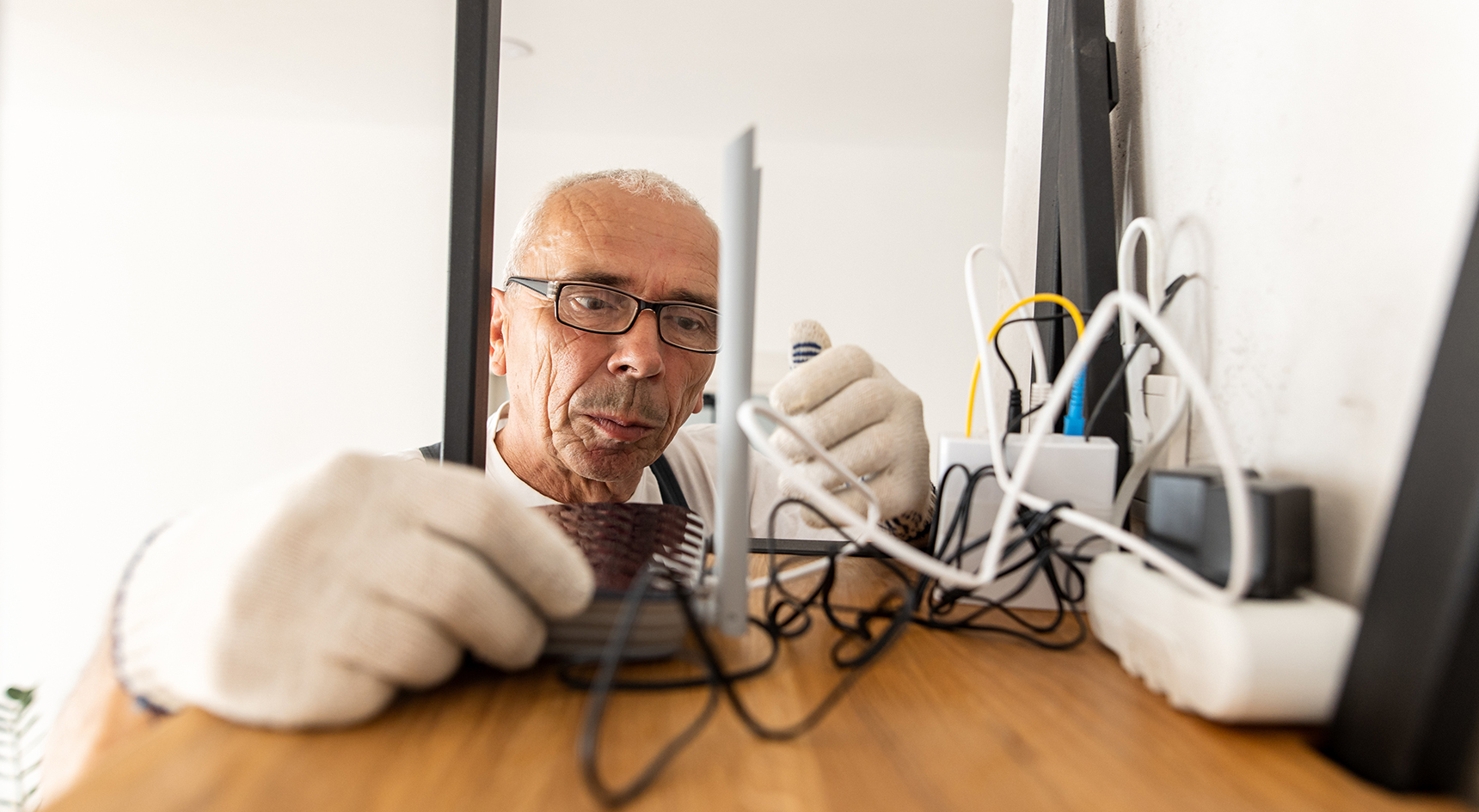 IT technician installing wifi router in an apartment