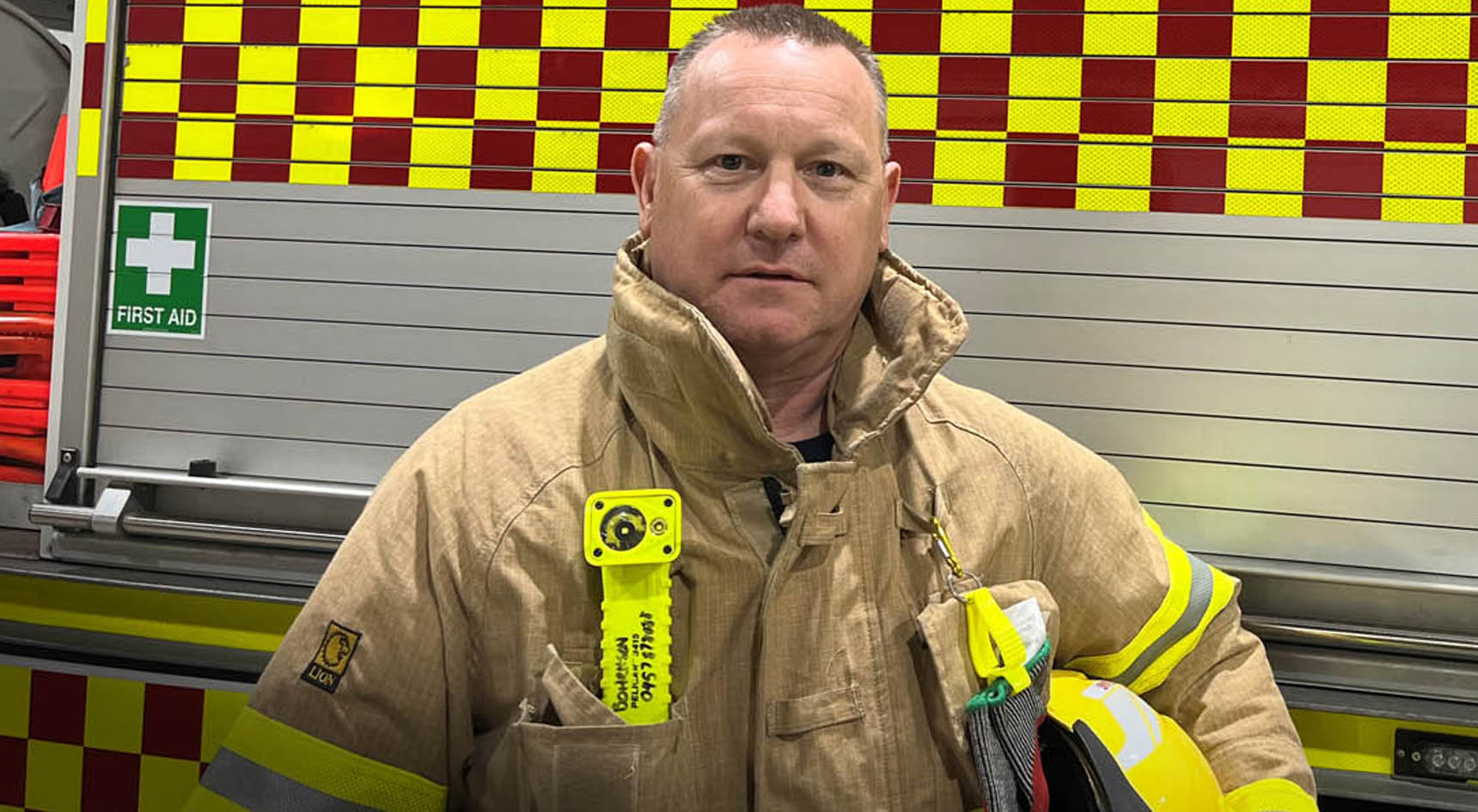 CFS Mount Barker volunteer Michael Bohrnsen standing in front of a CFS truck