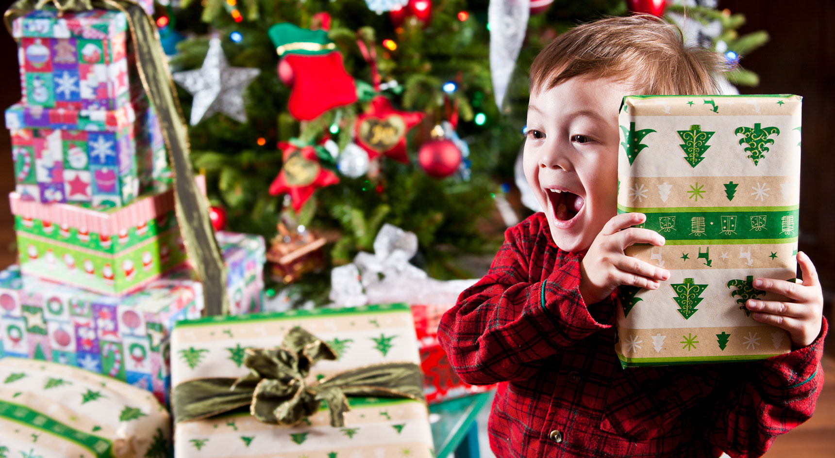 Child opening Christmas presents