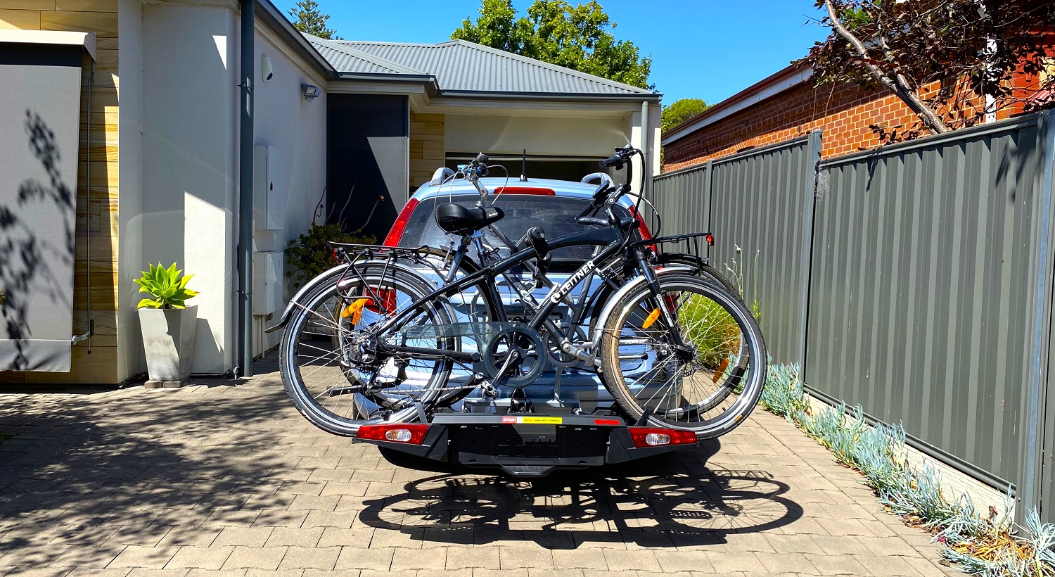 Number plate blocked by bike carrier.