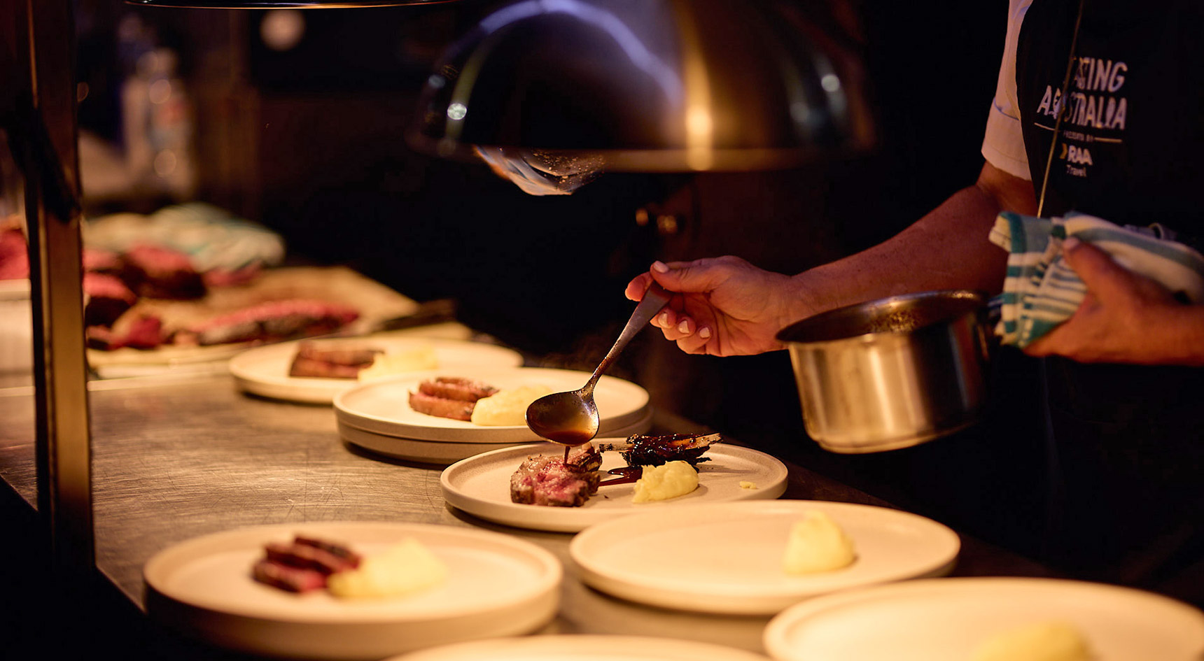 Chef dishing up steak